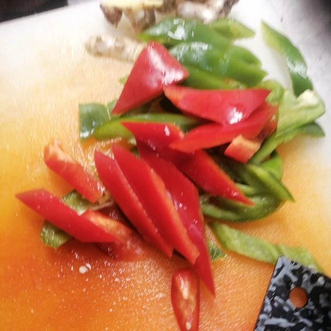 Close-up of stir-fried pork with chili peppers